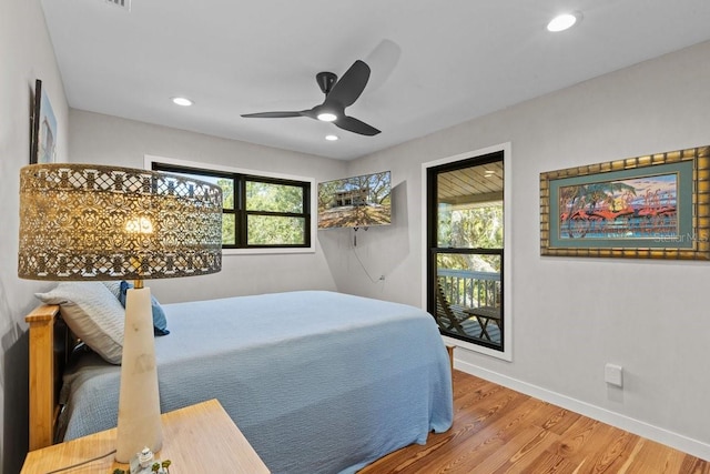 bedroom featuring hardwood / wood-style floors and ceiling fan