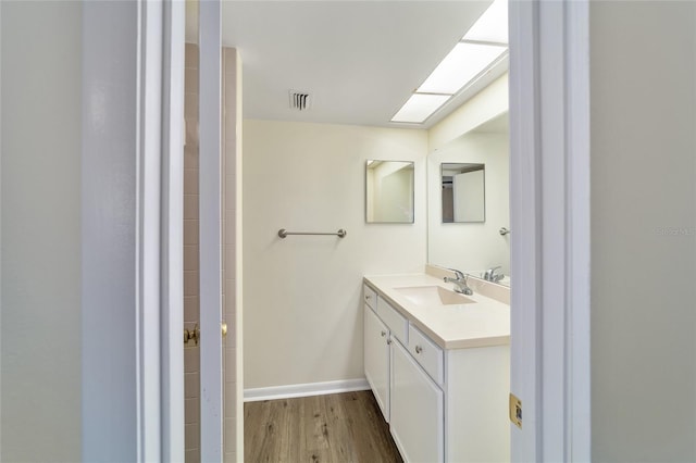 bathroom featuring hardwood / wood-style floors and vanity