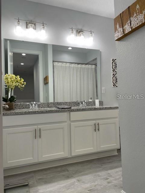 bathroom with double vanity