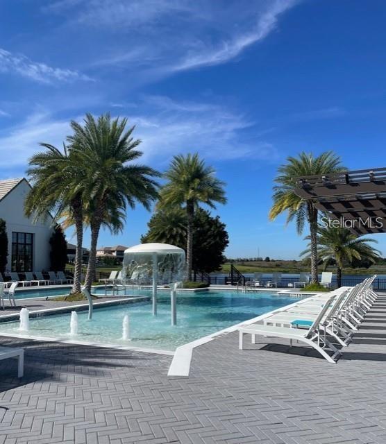 view of pool featuring pool water feature