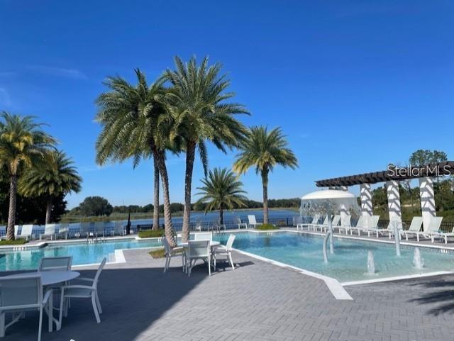 view of swimming pool with a patio area