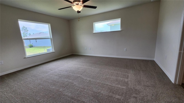 unfurnished room featuring a healthy amount of sunlight, ceiling fan, and carpet floors