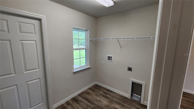 clothes washing area with hookup for a washing machine, dark hardwood / wood-style flooring, and hookup for an electric dryer