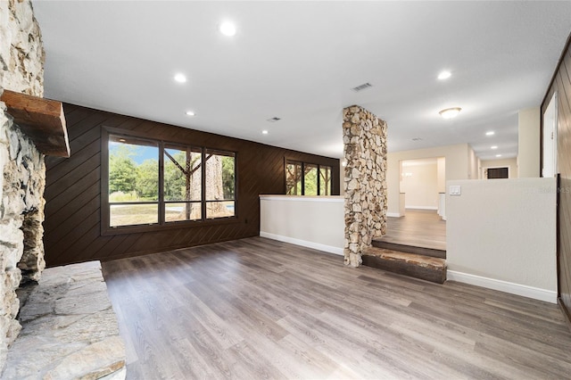 unfurnished living room with hardwood / wood-style flooring