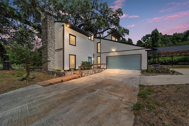 modern home with central AC and a garage