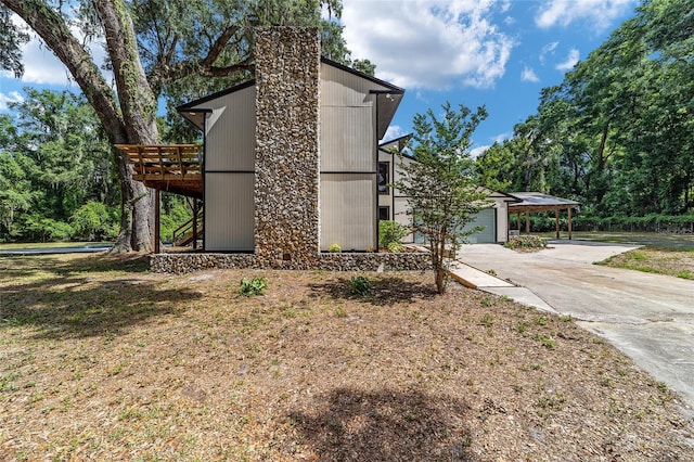 view of property exterior with a deck