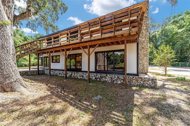 rear view of property with a deck