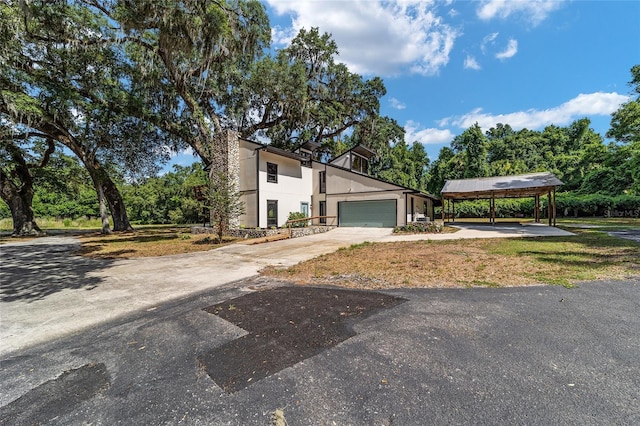 view of front facade featuring a garage and a carport