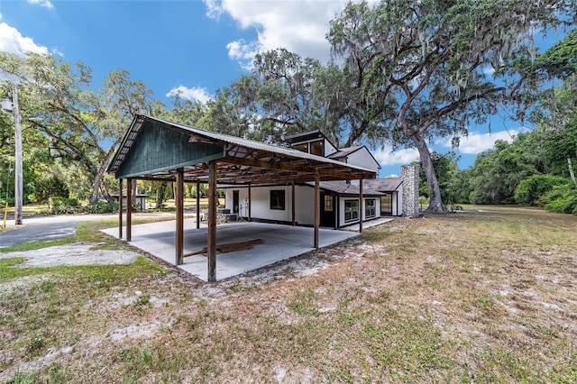 rear view of property featuring a patio area