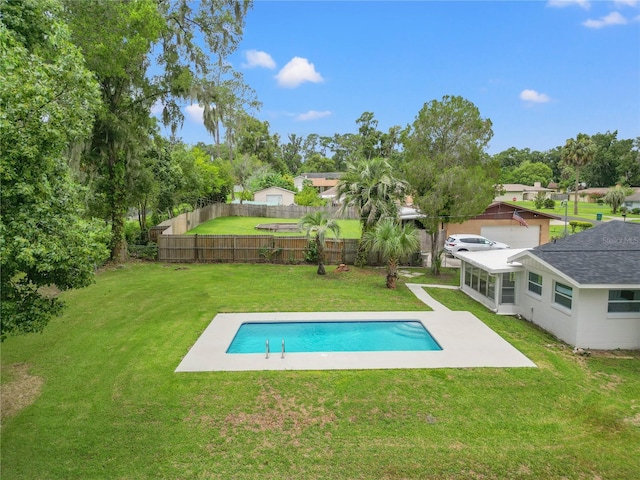 view of pool featuring a lawn, a sunroom, and a patio area