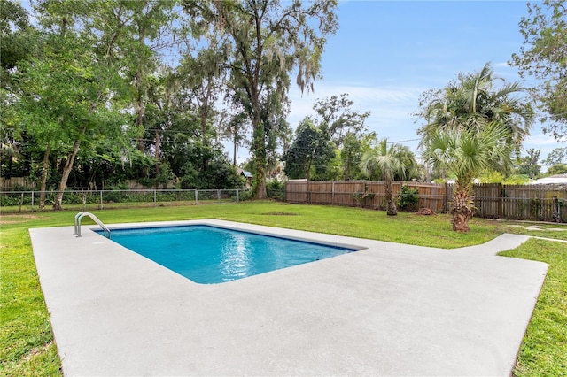 view of swimming pool featuring a lawn and a patio area