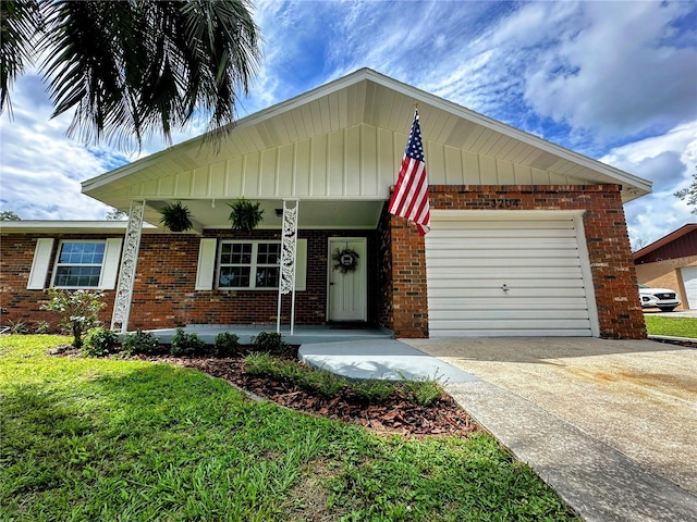 view of front of property with a porch and a garage