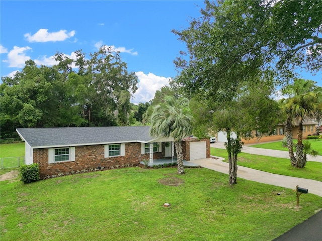 ranch-style home featuring a front lawn and a garage