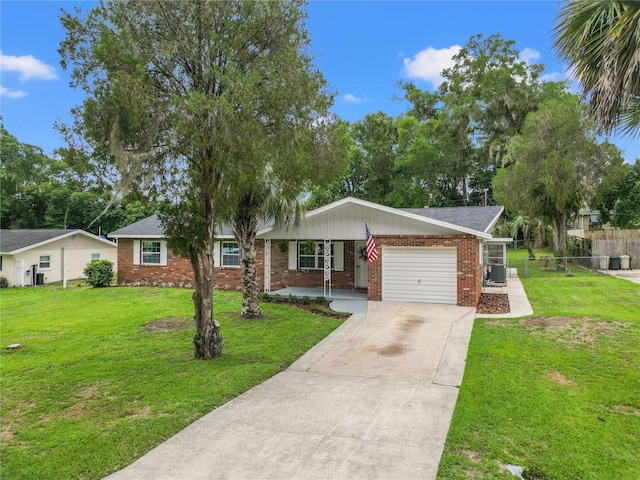 single story home featuring a front yard and a garage