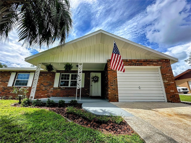 view of front of home featuring a garage and a porch