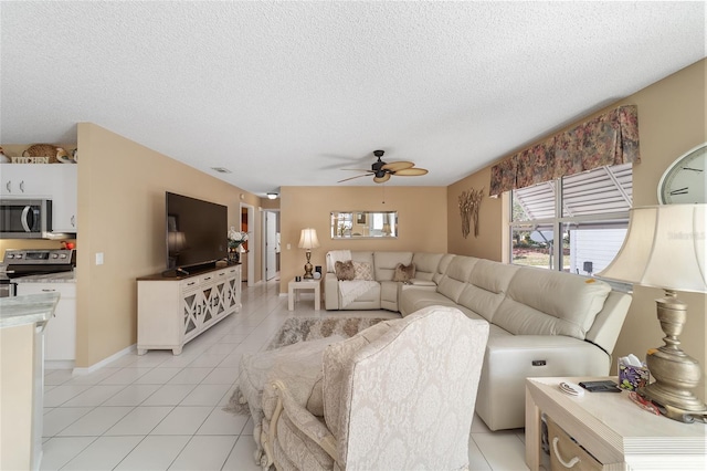 tiled living room featuring a textured ceiling and ceiling fan