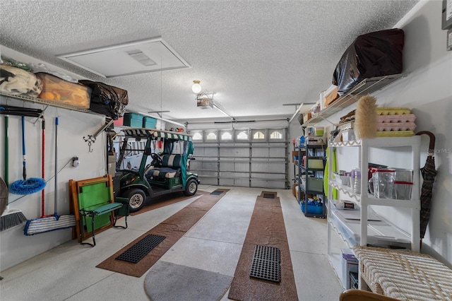 garage featuring a garage door opener