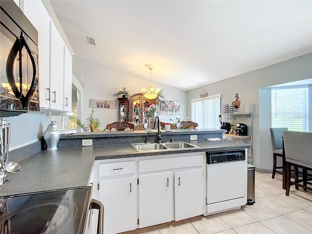 kitchen featuring dishwasher, white cabinets, lofted ceiling, and sink