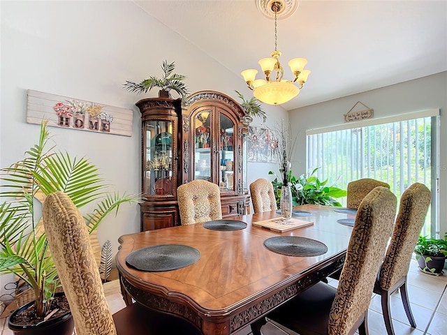 dining space with light tile patterned floors and a chandelier