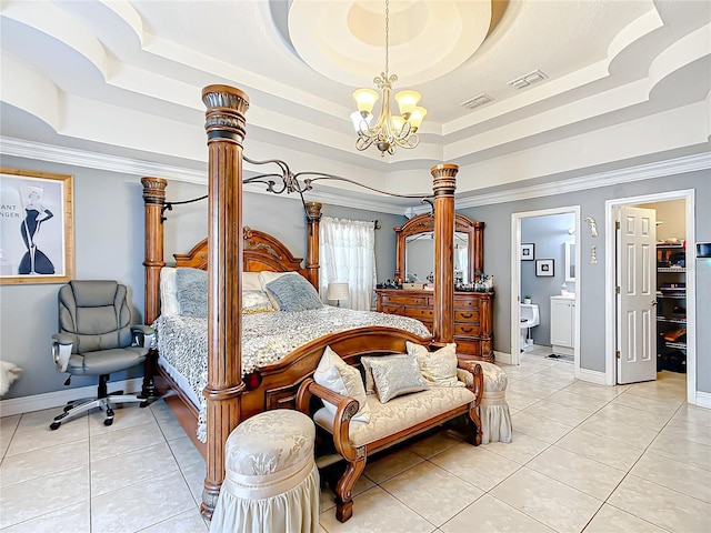 tiled bedroom with ensuite bath, ornamental molding, a chandelier, and a tray ceiling