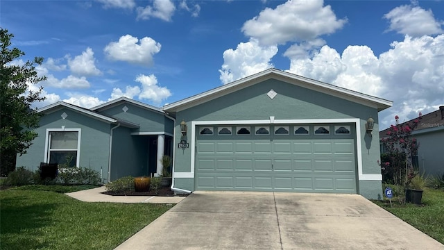 single story home with a garage and a front lawn