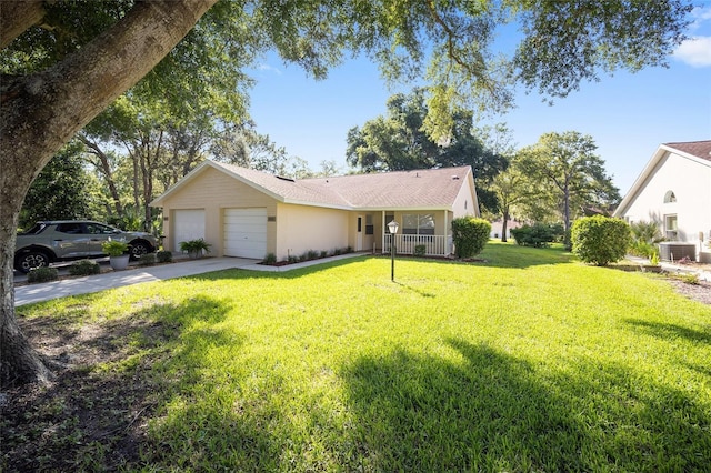 ranch-style home featuring a garage, cooling unit, and a front lawn