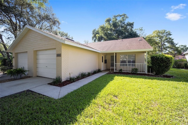 ranch-style house featuring a garage, a front lawn, and a porch