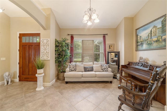 living area with light tile patterned floors and an inviting chandelier