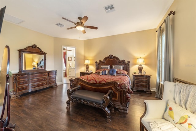 bedroom featuring ceiling fan, dark hardwood / wood-style floors, and ensuite bath