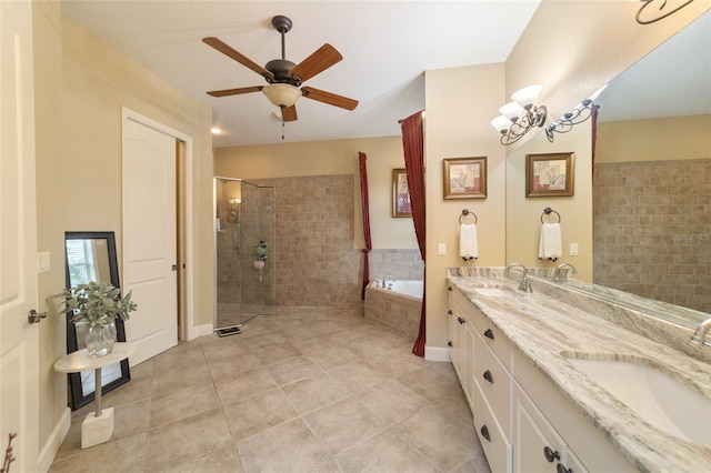 bathroom featuring ceiling fan with notable chandelier, tile patterned flooring, vanity, and shower with separate bathtub