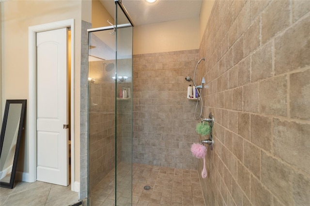 bathroom with tiled shower