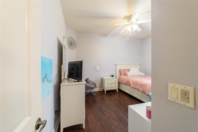 bedroom featuring ceiling fan and dark hardwood / wood-style floors