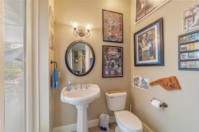 bathroom featuring sink and toilet