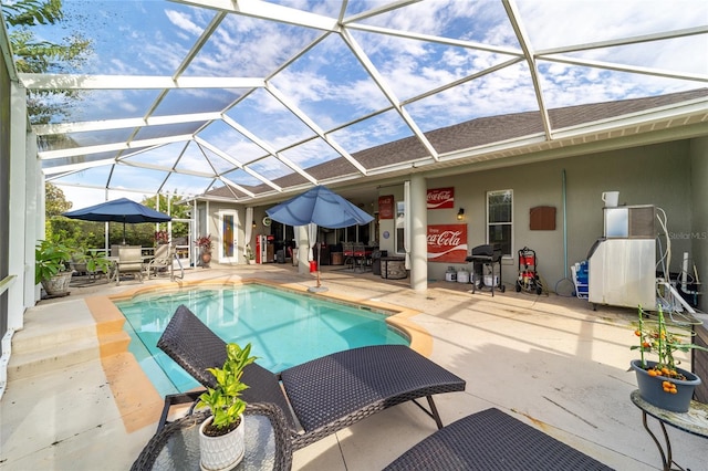 view of pool featuring a patio area and a lanai