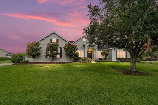 view of front of property with a lawn