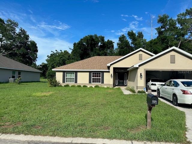 ranch-style house with a front yard and a garage