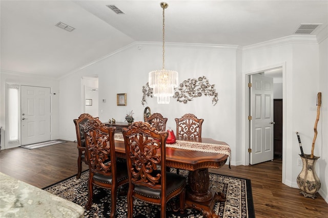 dining area featuring crown molding, dark hardwood / wood-style flooring, a chandelier, and lofted ceiling