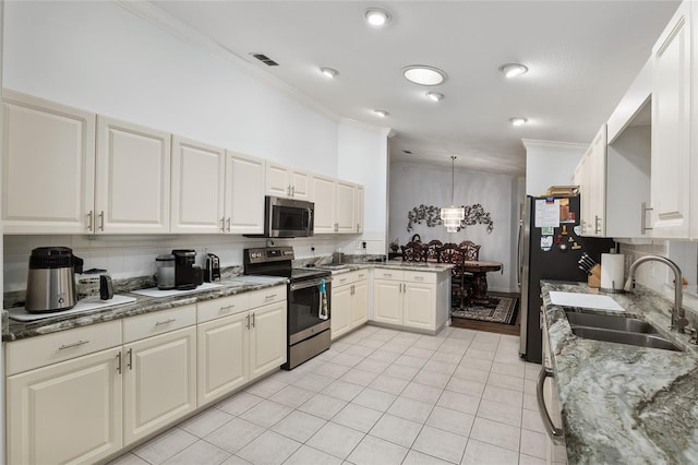 kitchen with appliances with stainless steel finishes, decorative light fixtures, light tile patterned floors, and sink