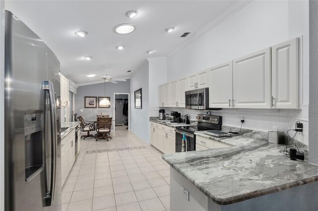 kitchen featuring kitchen peninsula, ceiling fan, light tile patterned floors, appliances with stainless steel finishes, and white cabinetry