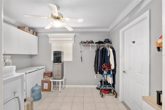 laundry room with ceiling fan, cabinets, light tile patterned floors, washer and dryer, and ornamental molding