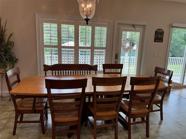 dining room with a chandelier and plenty of natural light