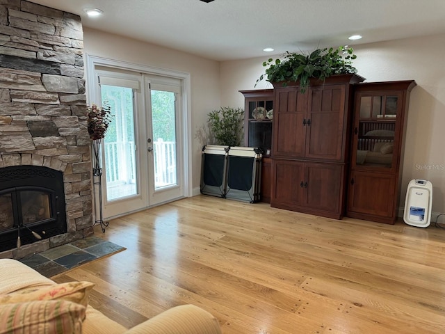 living room featuring a fireplace and light hardwood / wood-style floors