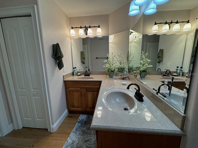 bathroom featuring vanity and wood-type flooring