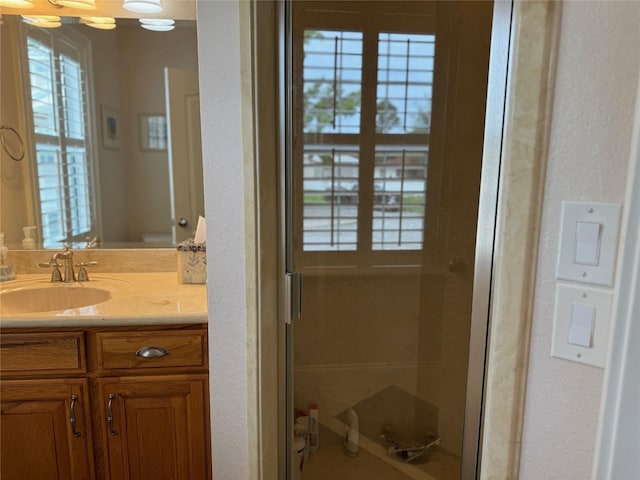 bathroom with vanity and walk in shower