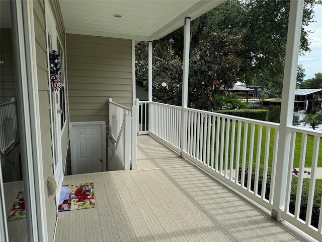 balcony with a porch and a water view