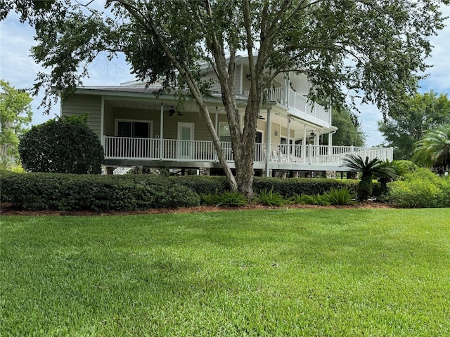 back of house with a yard