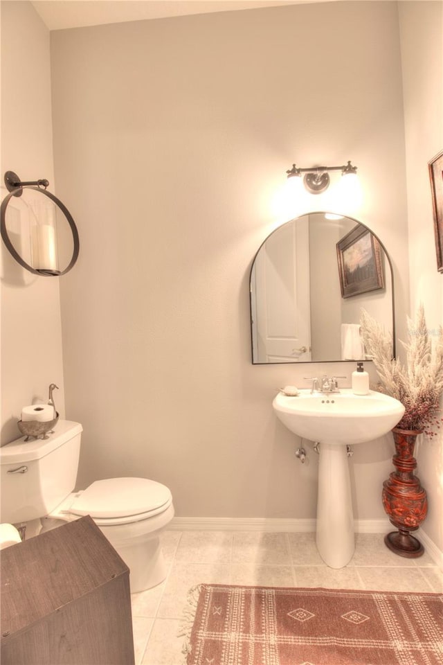 bathroom featuring tile patterned floors and toilet