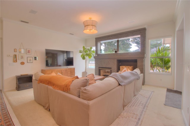 living room featuring ornamental molding and light carpet