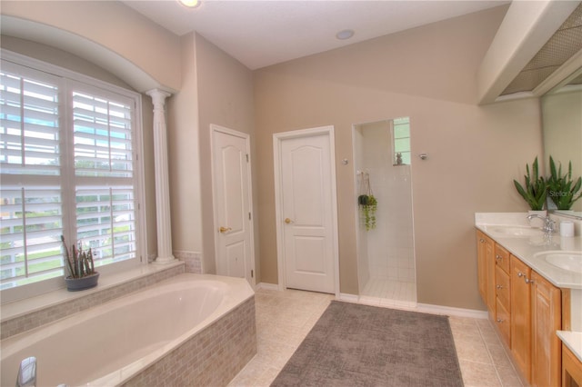 bathroom featuring vaulted ceiling, shower with separate bathtub, decorative columns, tile patterned flooring, and vanity