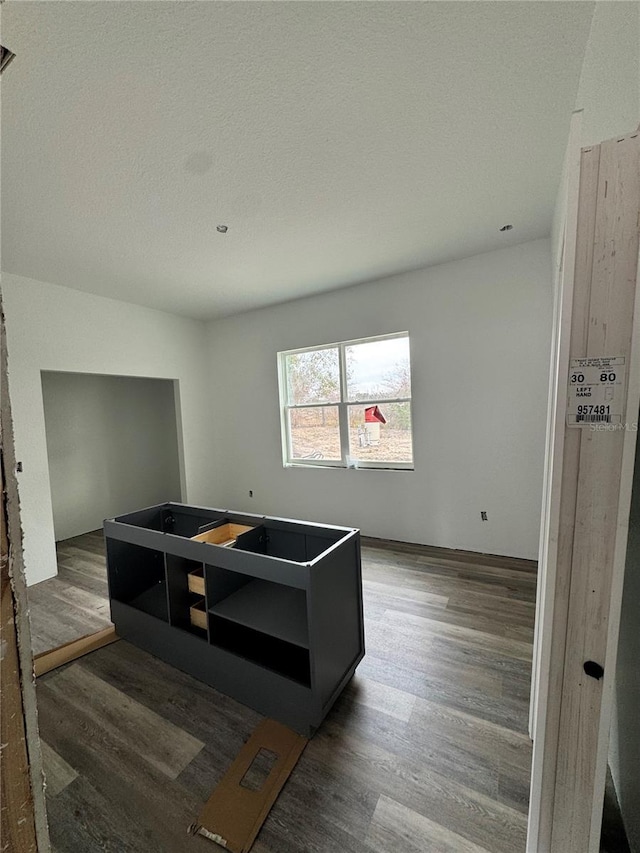 bedroom with dark wood-type flooring